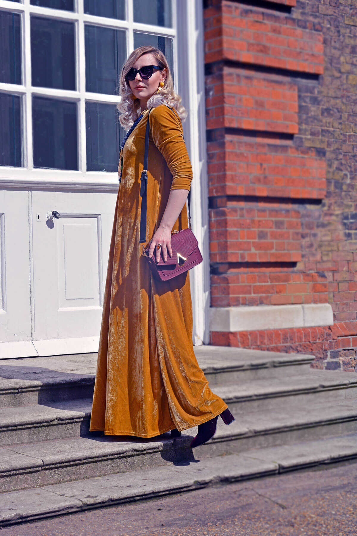 edita in mustard yellow dress