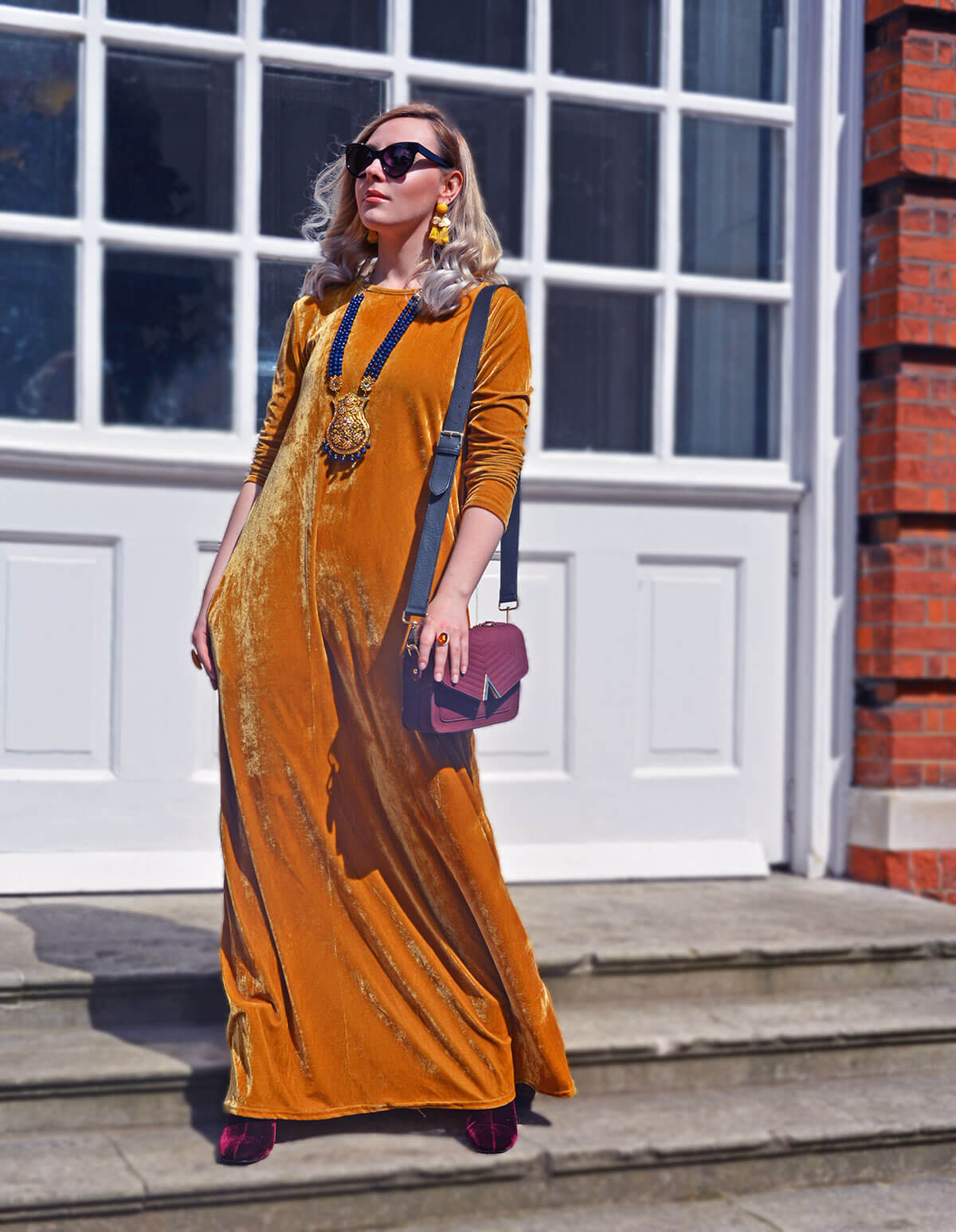 edita in mustard yellow dress