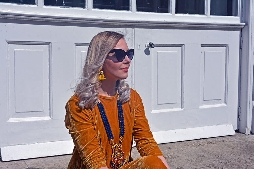 edita in mustard yellow dress