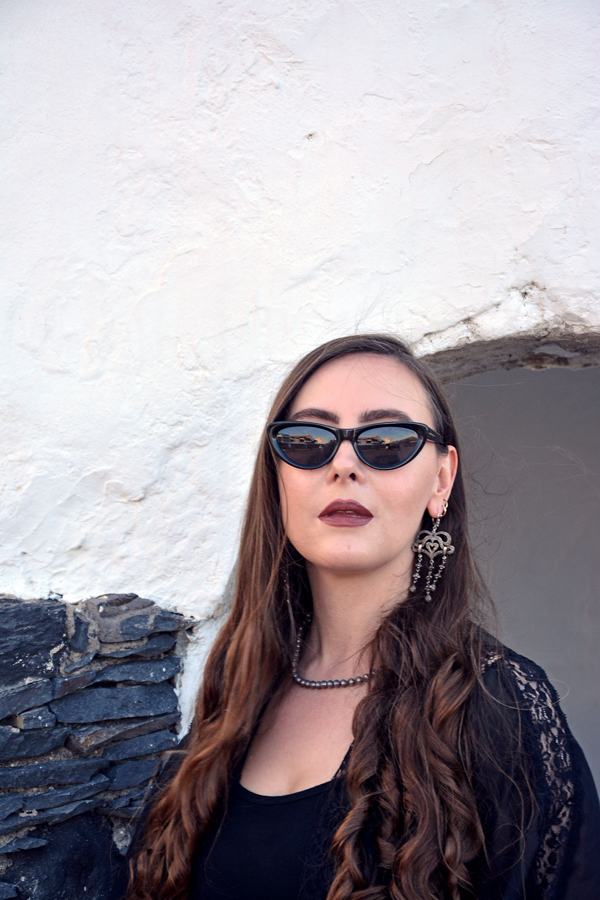 Content creator in silver earrings and silver bead necklace in Tenerife