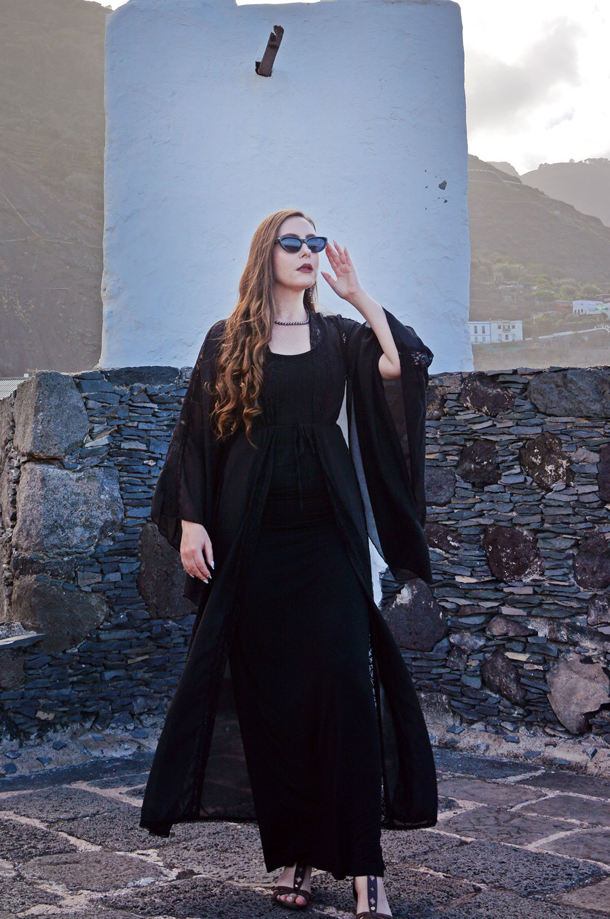 Content creator in silver earrings and silver bead necklace in Tenerife