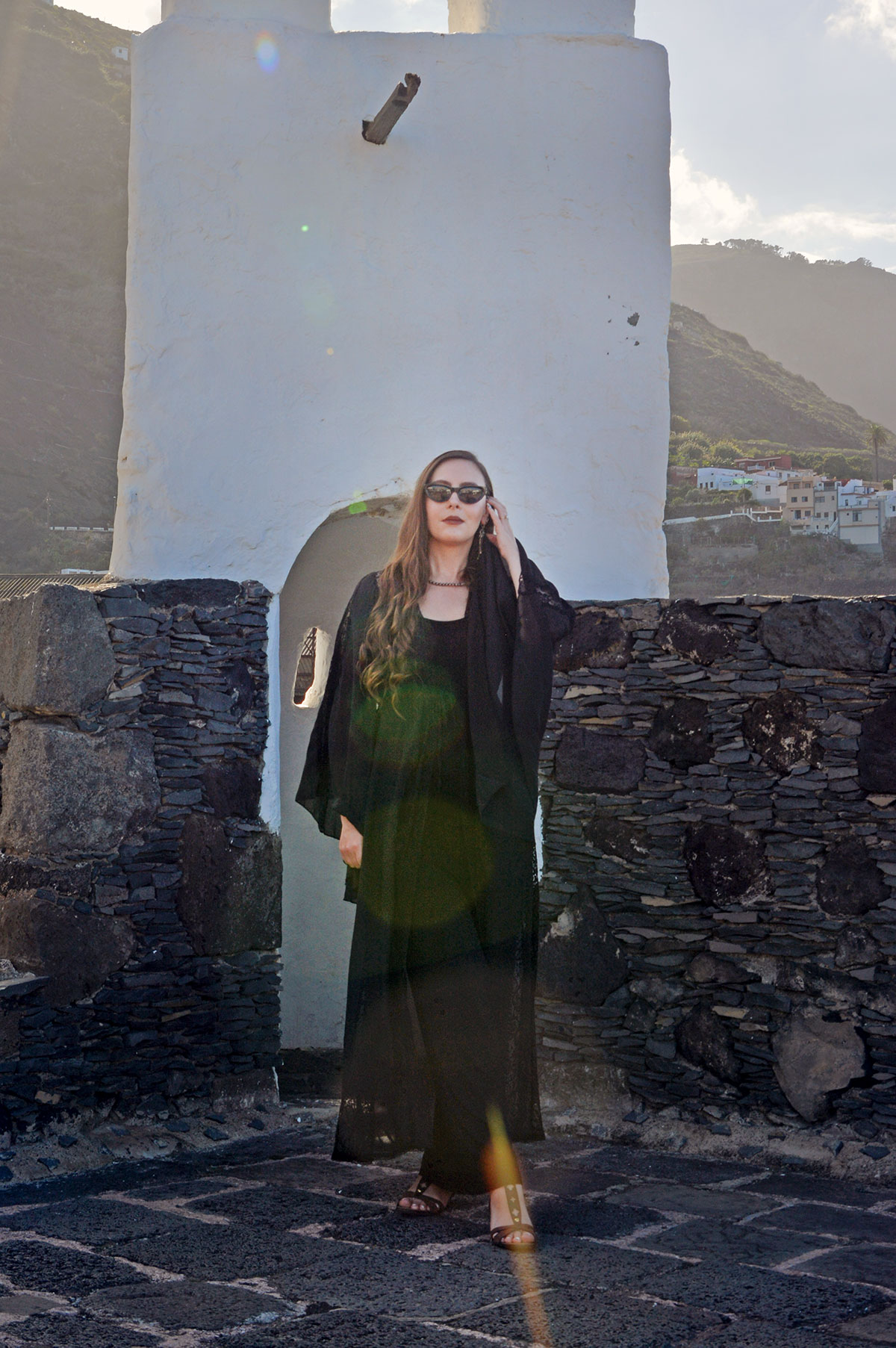 Content creator in silver earrings and silver bead necklace in Tenerife
