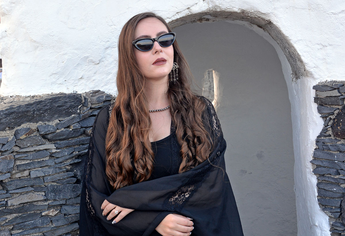 Content creator in silver earrings and silver bead necklace in Tenerife
