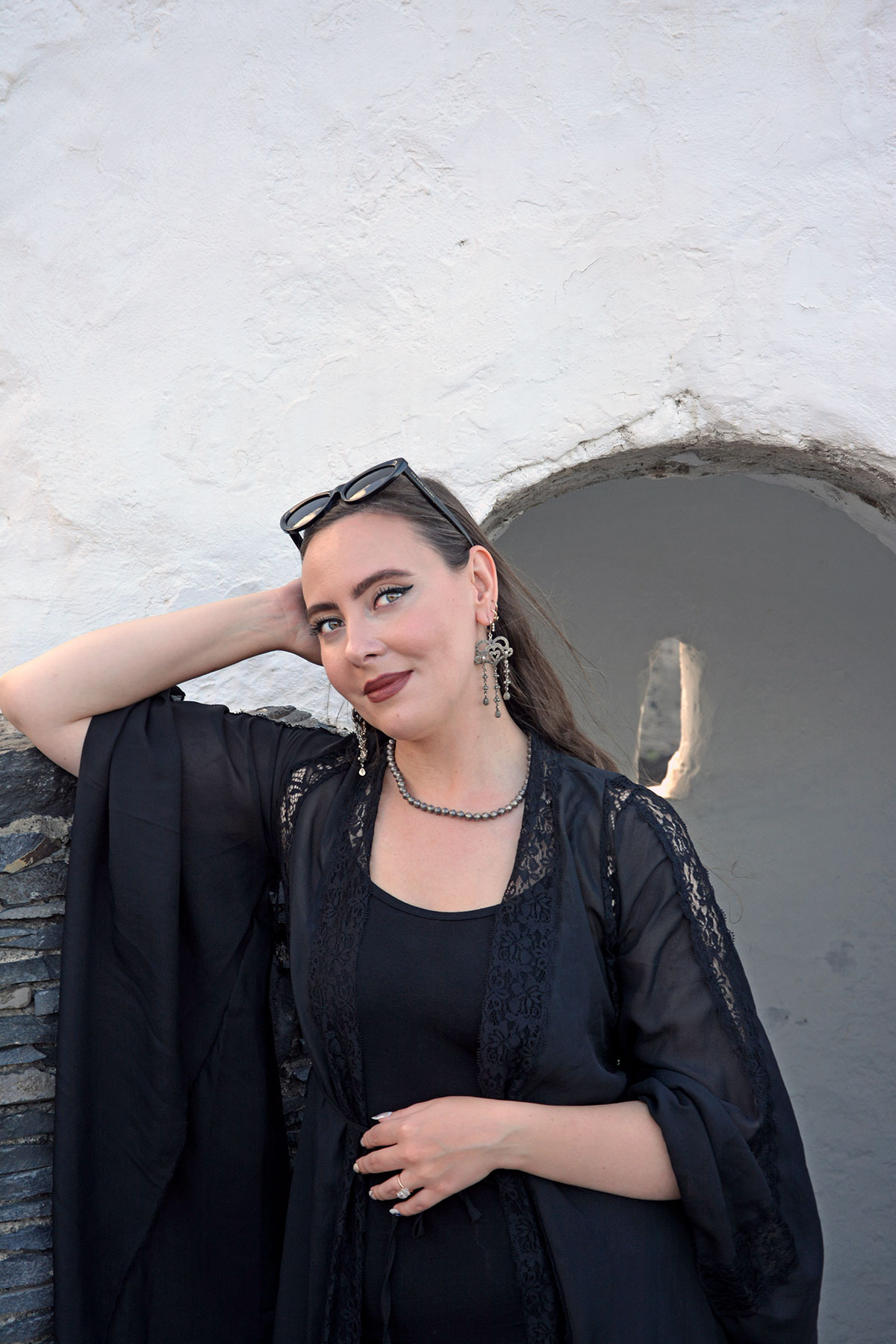 Content creator in silver earrings and silver bead necklace in Tenerife