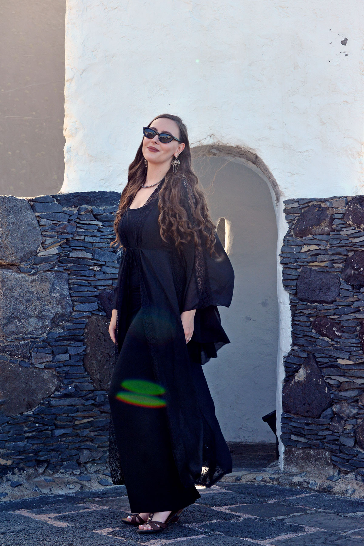 Content creator in silver earrings and silver bead necklace in Tenerife